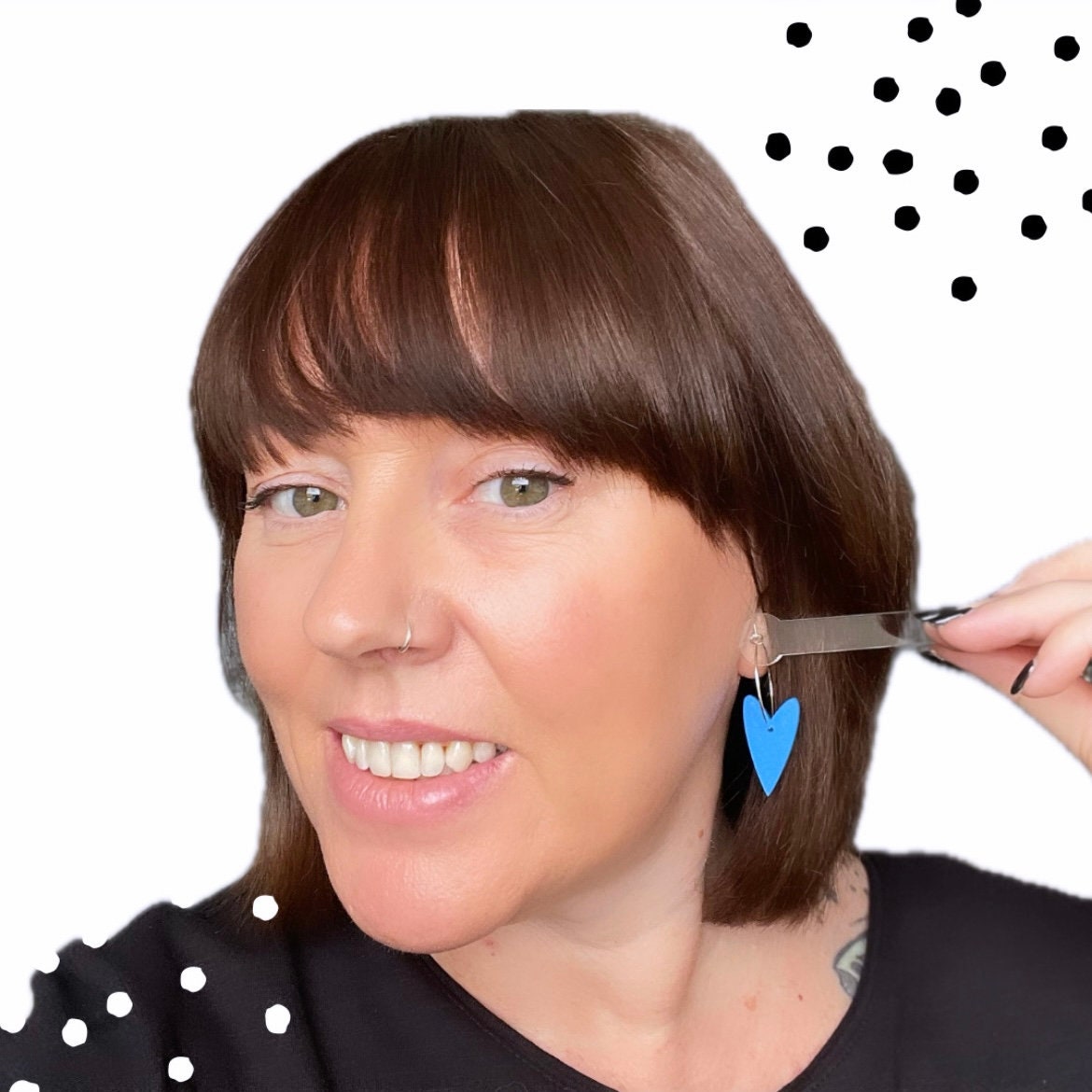 Try on picture with me wearing the blue heart hoop earrings for size reference