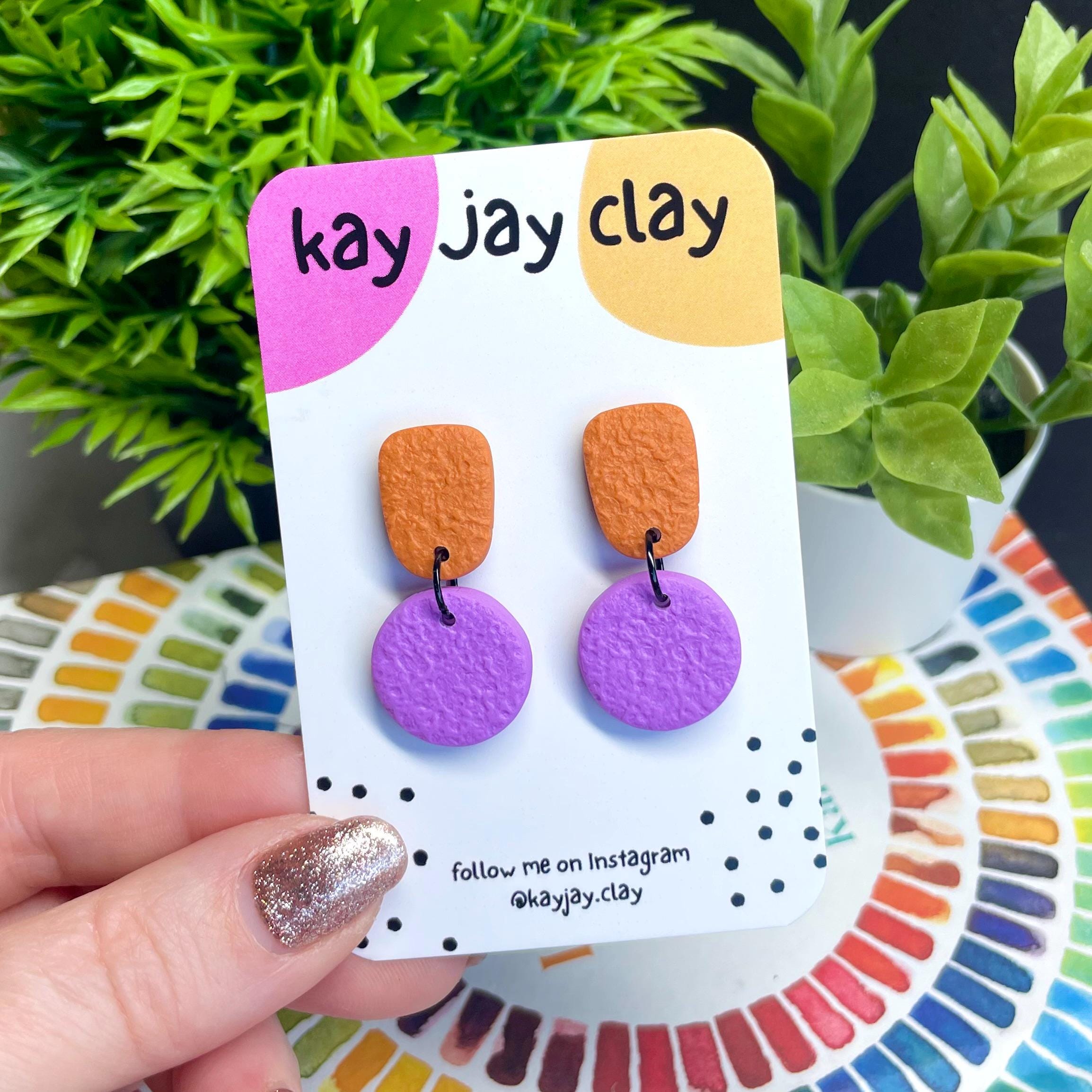 Colour block dangle earrings - burnt orange & lilac on mounting card