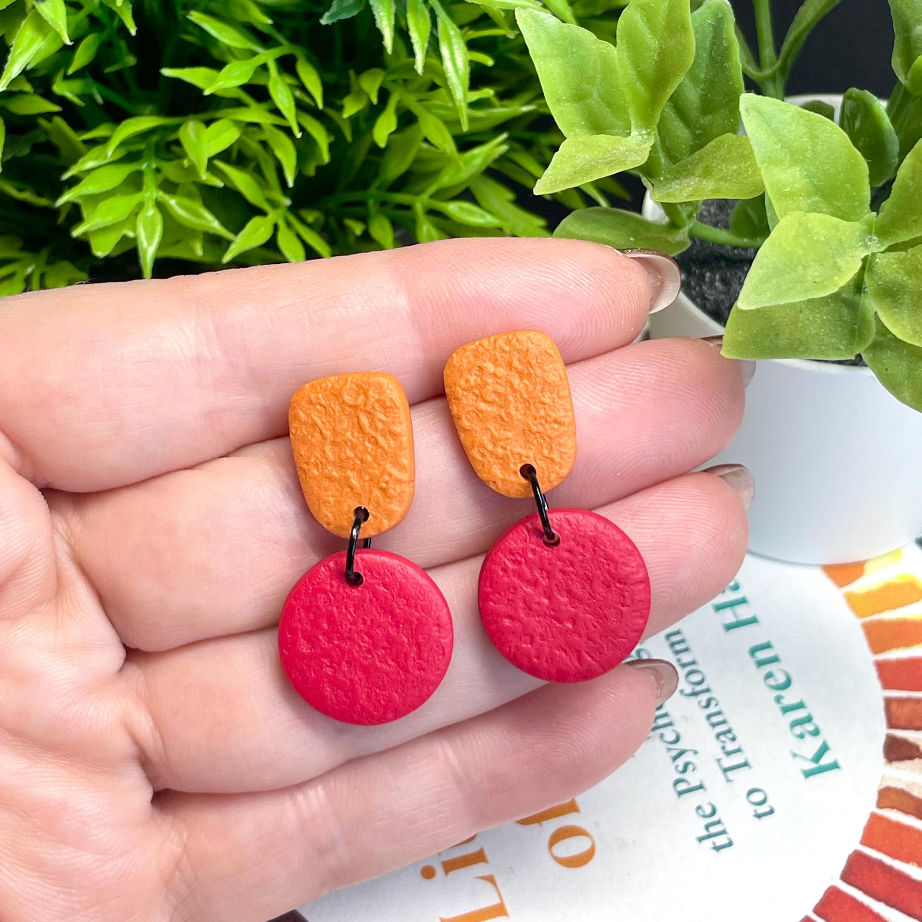 Colour block dangle earrings - burnt orange & red hand held