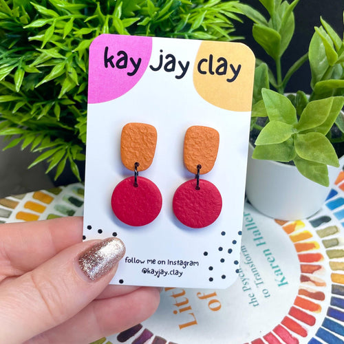Colour block dangle earrings - burnt orange & red on mounting card