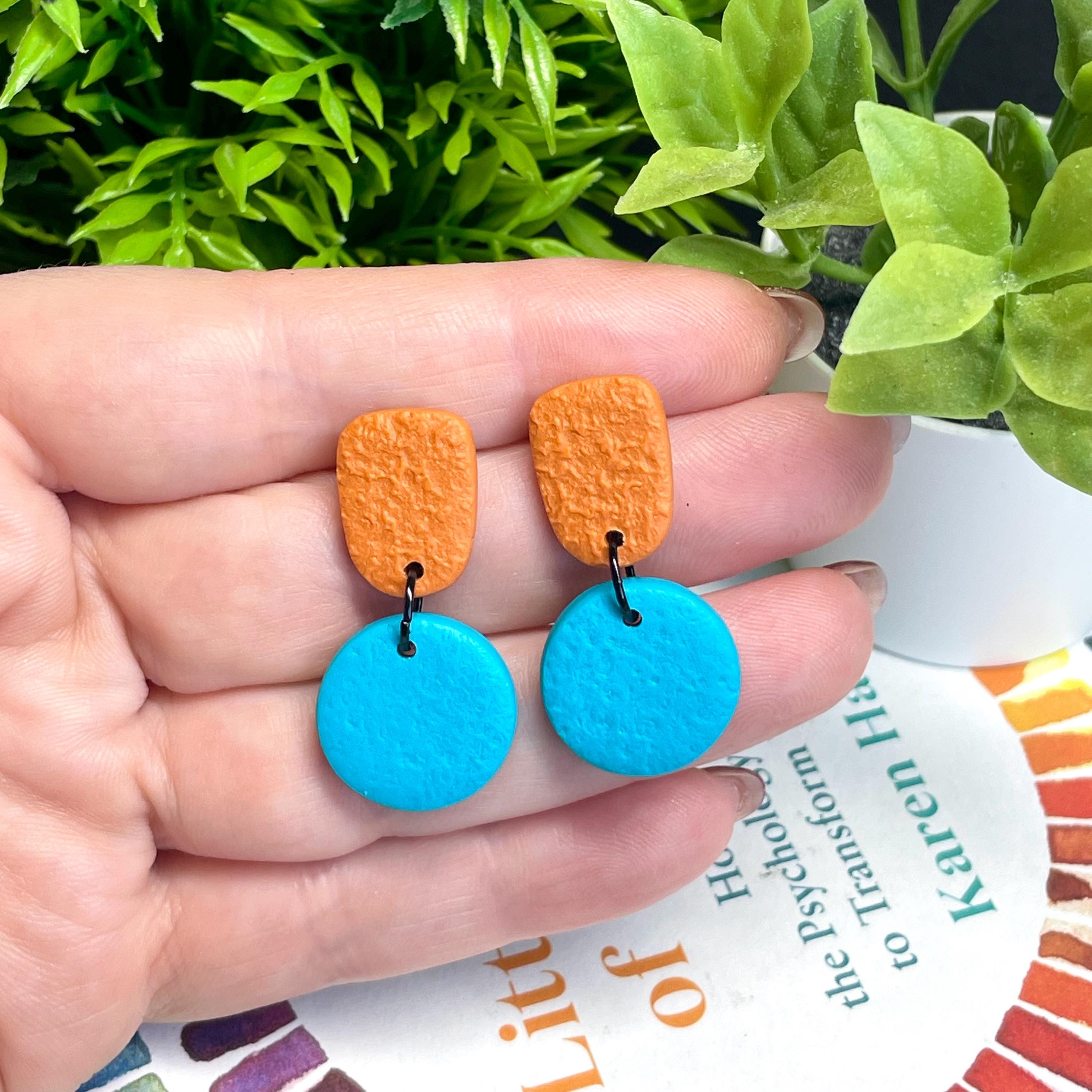 Colour block dangle earrings - burnt orange & turquoise hand held