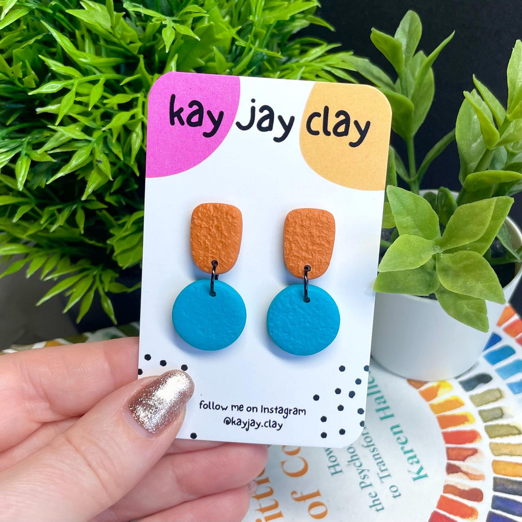Colour block dangle earrings - burnt orange & turquoise on mounting card
