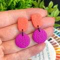 Colour block dangle earrings - coral & hot pink  hand held