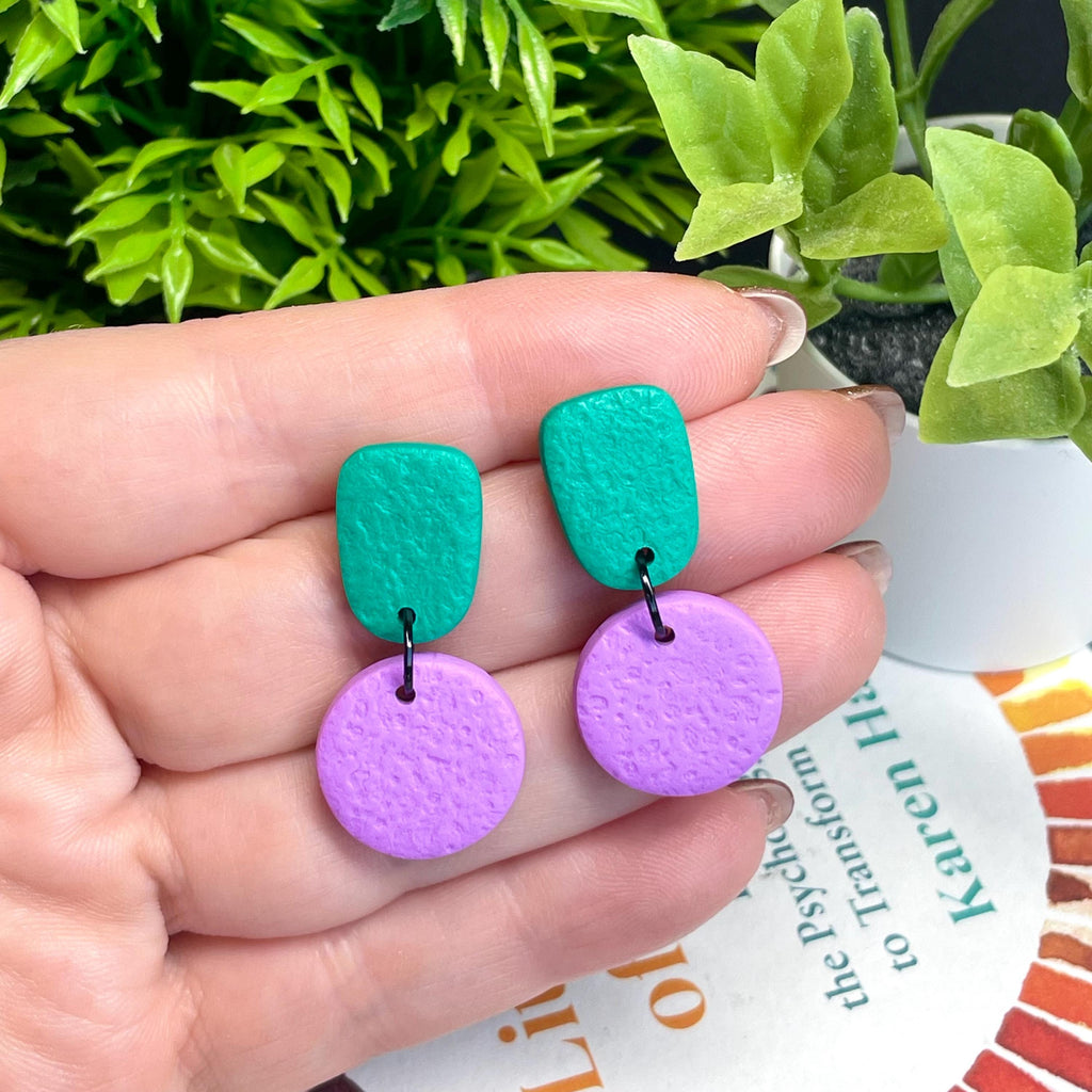 Colour block dangle earrings - emerald green & lilac hand held