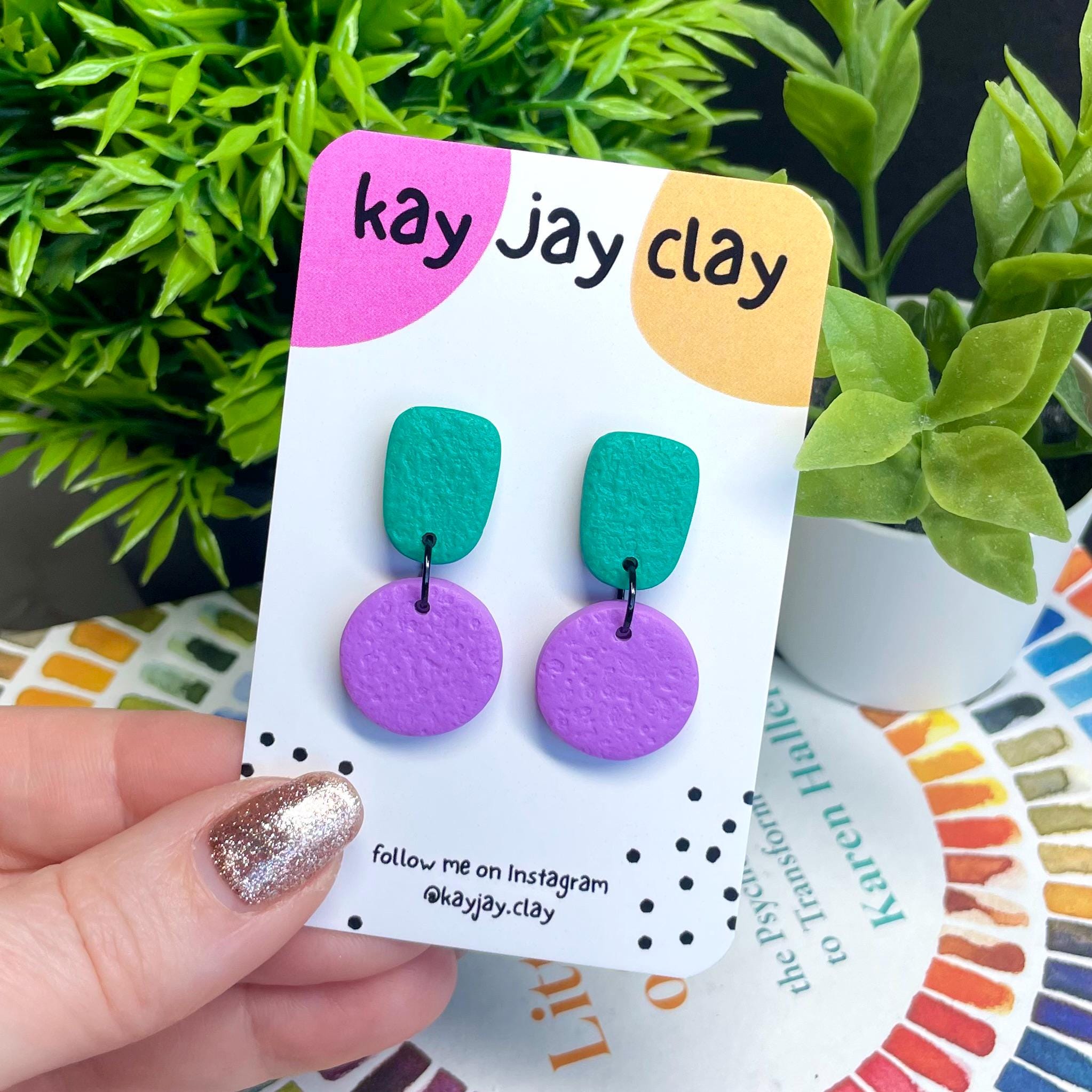 Colour block dangle earrings - emerald green & lilac on mounting card