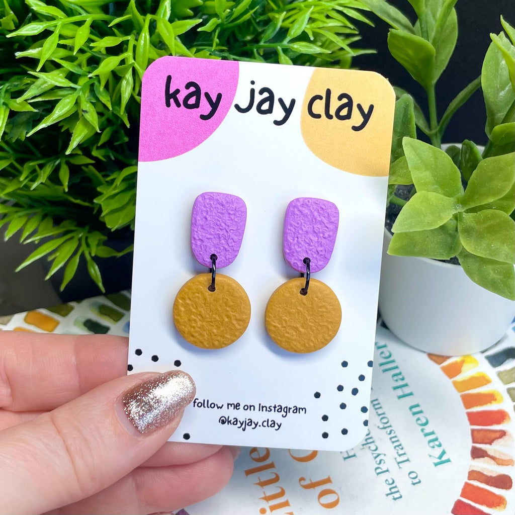 Colour block dangle earrings - lilac & mustard yellow on mounting card