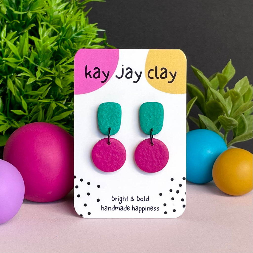 Emerald Green & Hot Pink colour pop dangle earrings on Kay Jay Clay branded mounting card