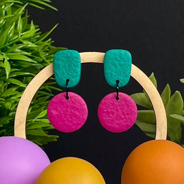 Emerald Green & Hot Pink colour pop dangle earrings on hoop display prop