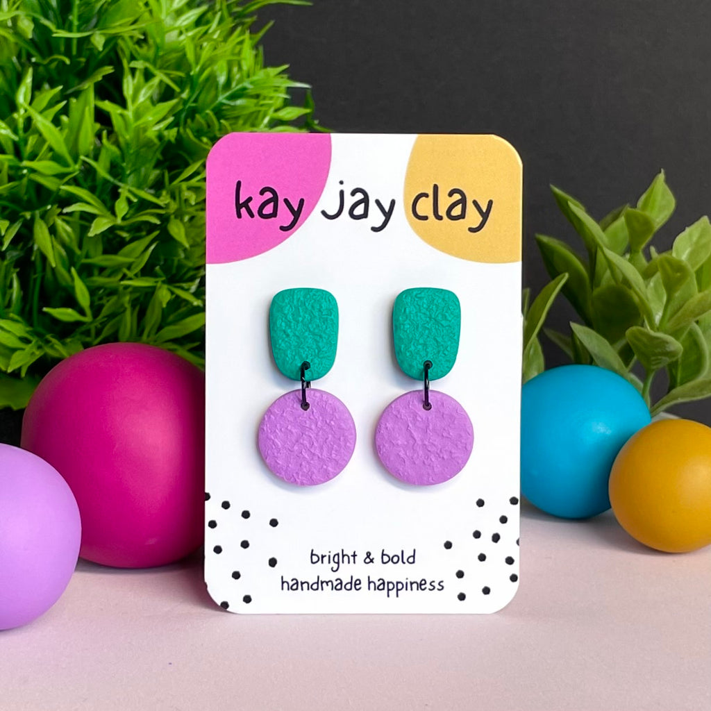 Emerald Green & Lilac colour pop dangle earrings on Kay Jay Clay branded mounting card