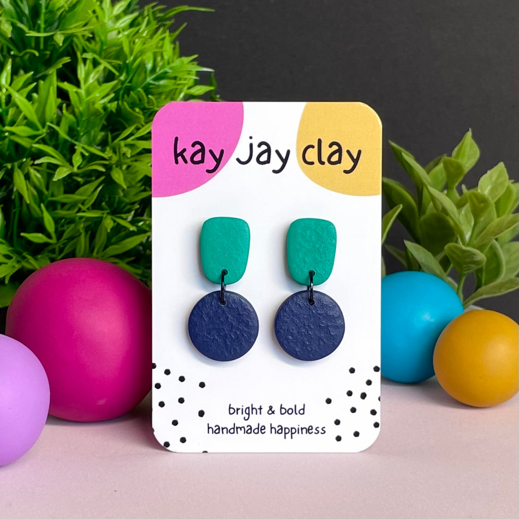 Emerald Green & Navy Blue colour pop dangle earrings on Kay Jay Clay branded mounting card