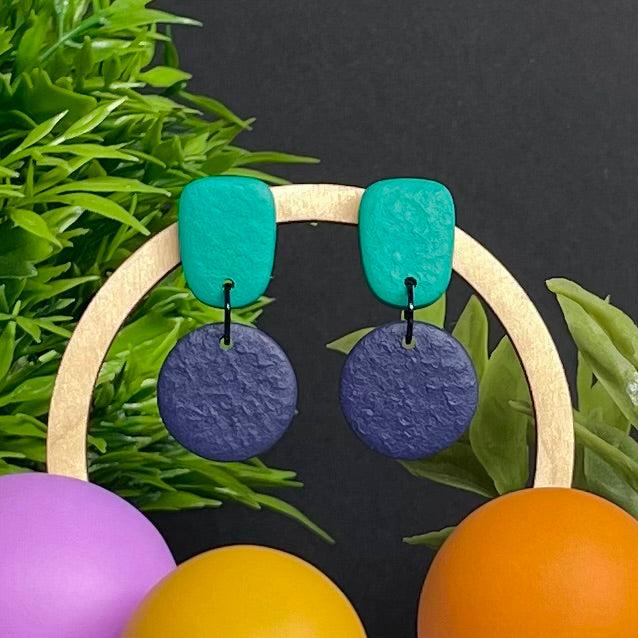 Emerald Green & Navy Blue colour pop dangle earrings on hoop display prop