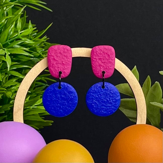 Hot Pink & Electric Blue colour pop dangle earrings on hoop display prop