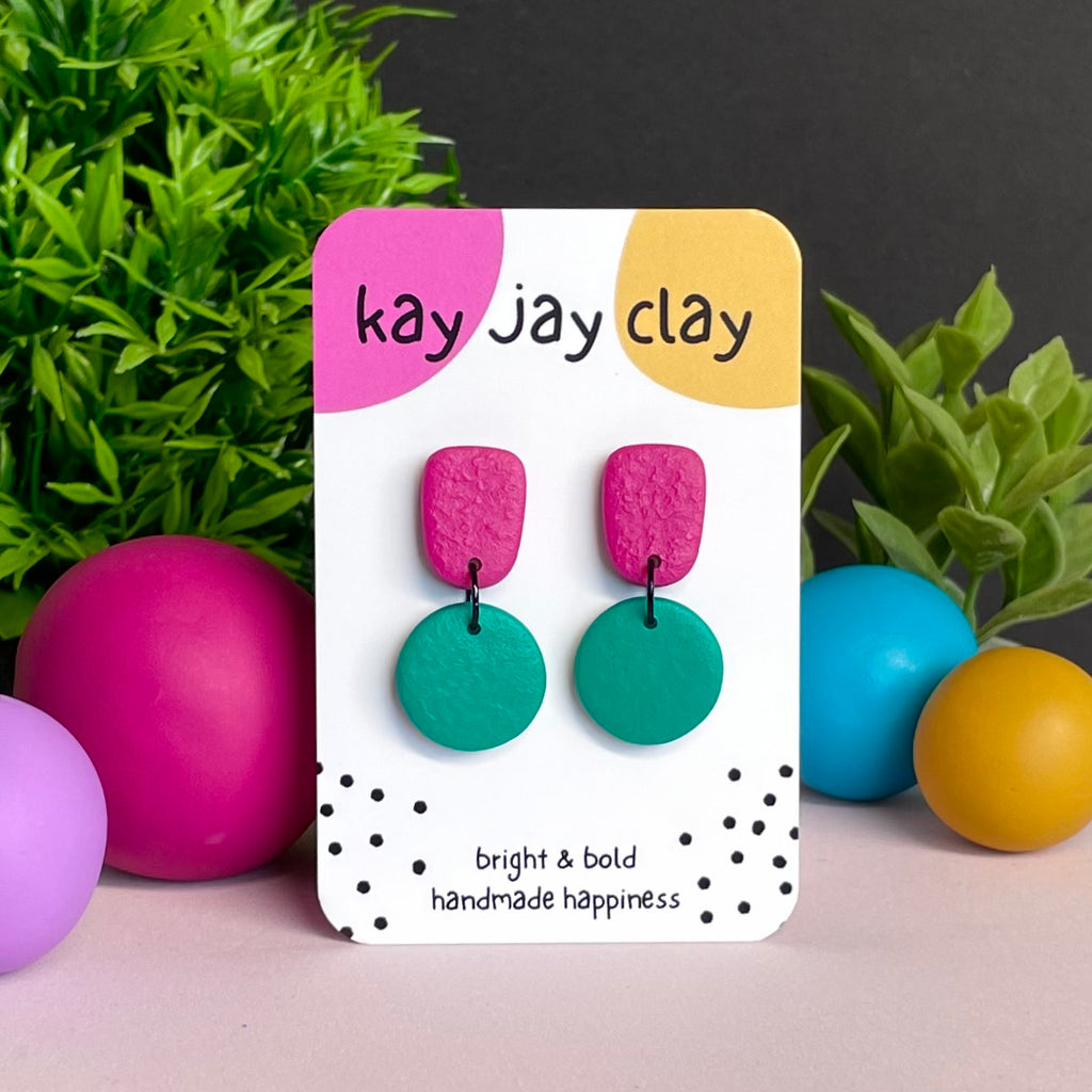 Hot Pink & Emerald Green colour pop dangle earrings on Kay Jay Clay branded mounting card