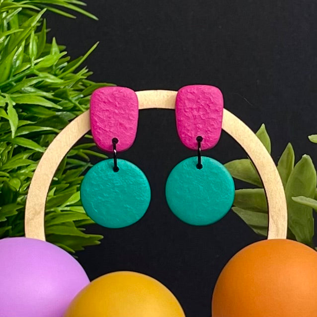 Hot Pink & Emerald Green colour pop dangle earrings on hoop display prop