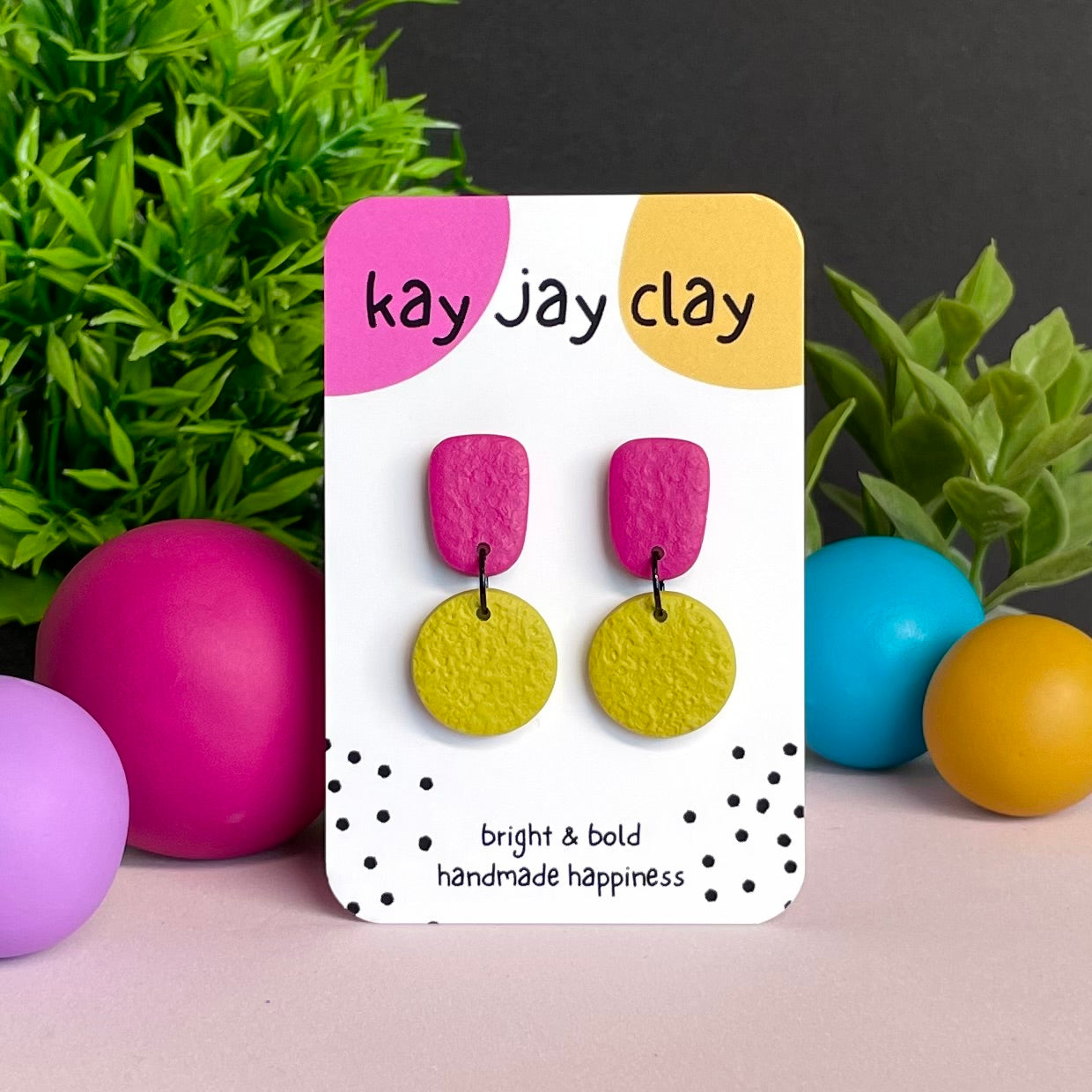 Hot Pink & Pistachio Green colour pop dangle earrings on Kay Jay Clay branded mounting card