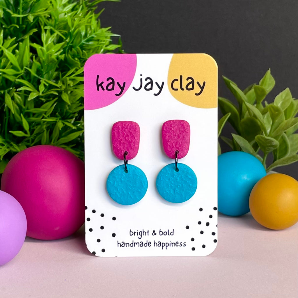 Hot Pink & Turquoise colour pop dangle earrings on Kay Jay Clay branded mounting card