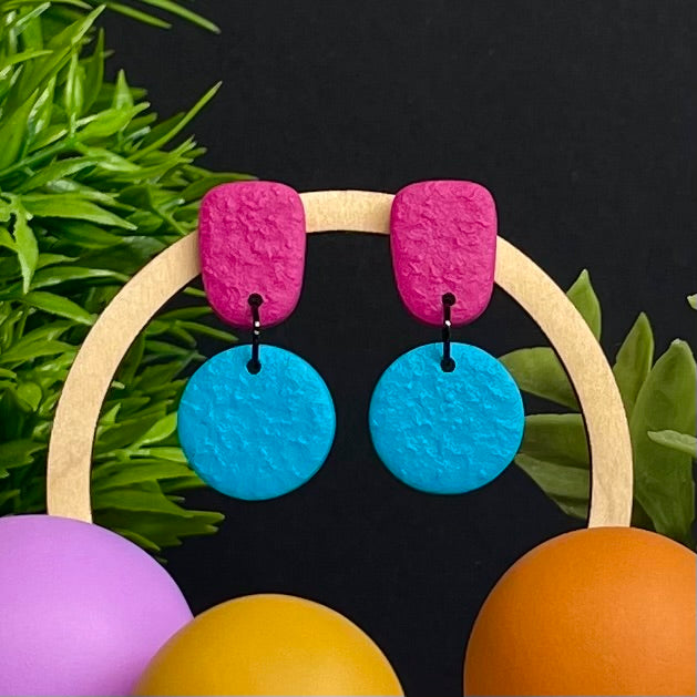 Hot Pink & Turquoise colour pop dangle earrings on hoop display prop