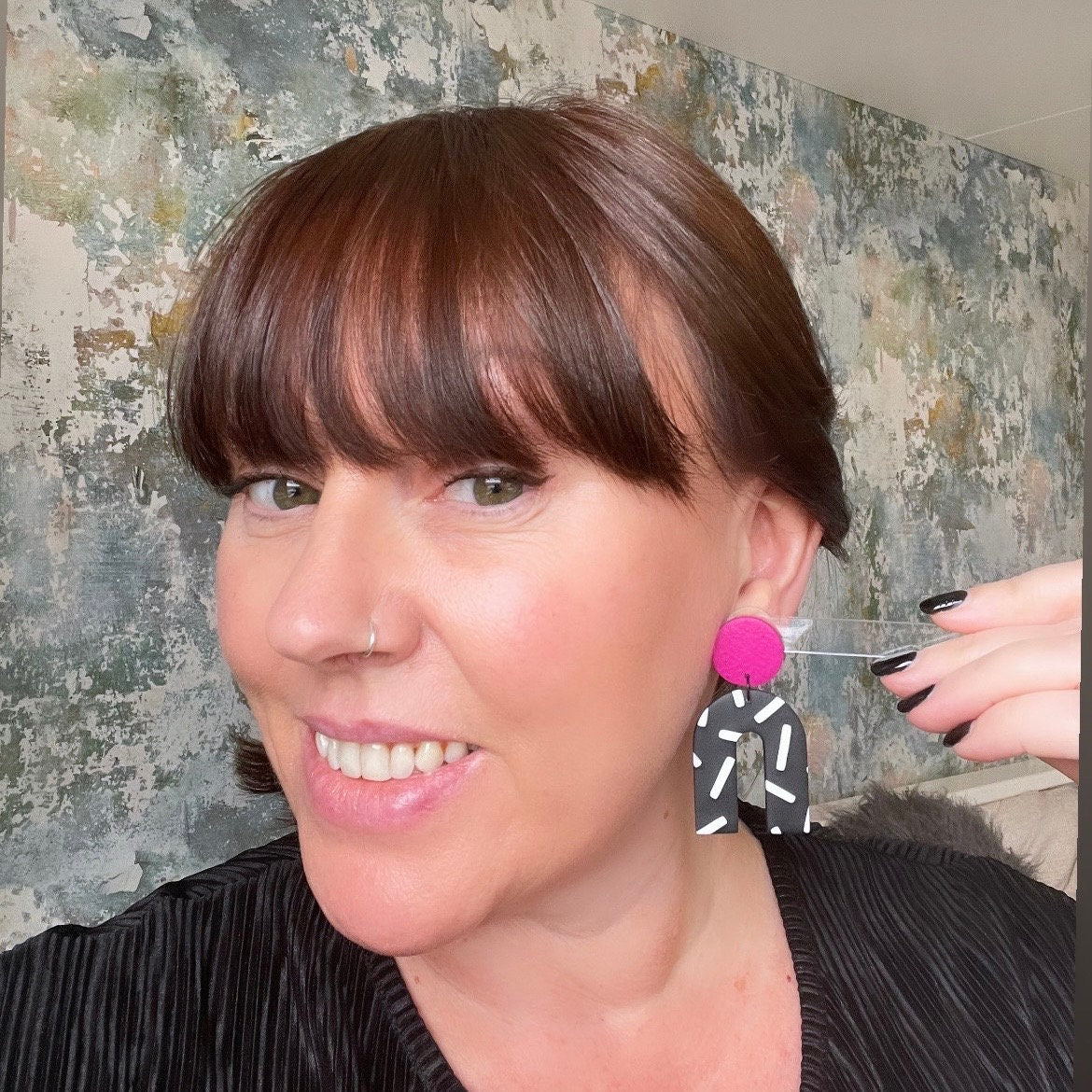 Try on picture of Kerry from Kay Jay Clay wearing the Hot pink and monochrome sprinkles arch dangle earrings
