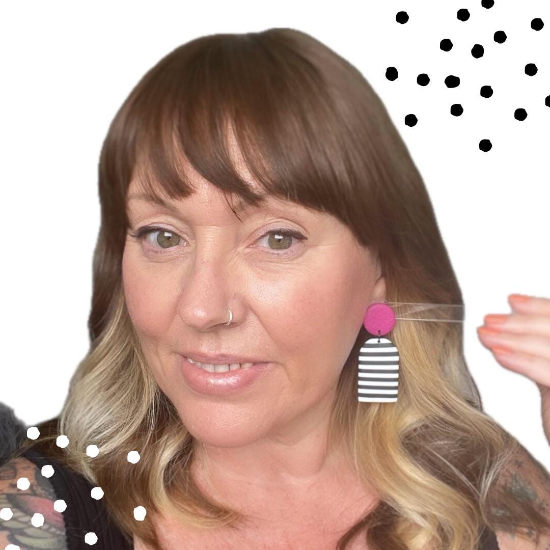 try on picture of Kerry from Kay Jay Clay wearing the Hot pink monochrome stripe dangle earrings for size reference