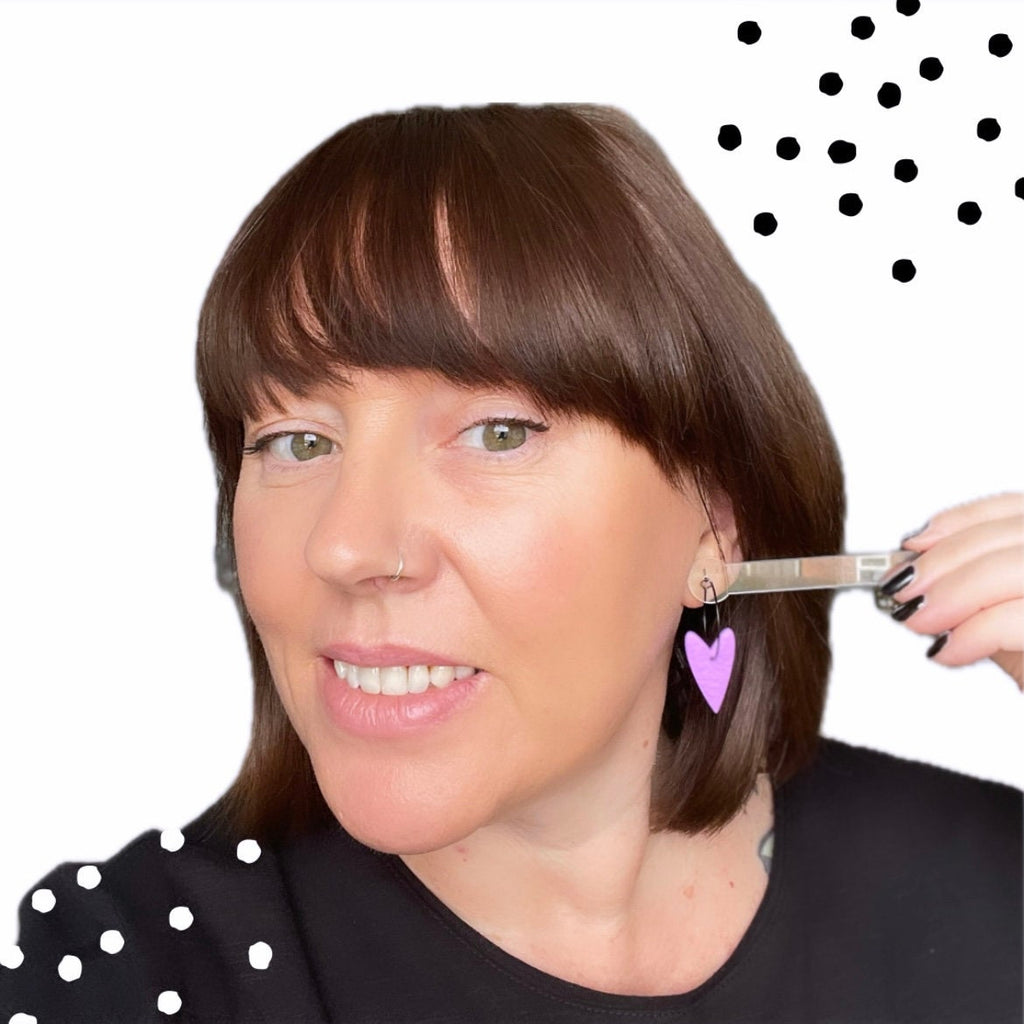 Try on picture of me wearing the lilac heart hoops for size reference