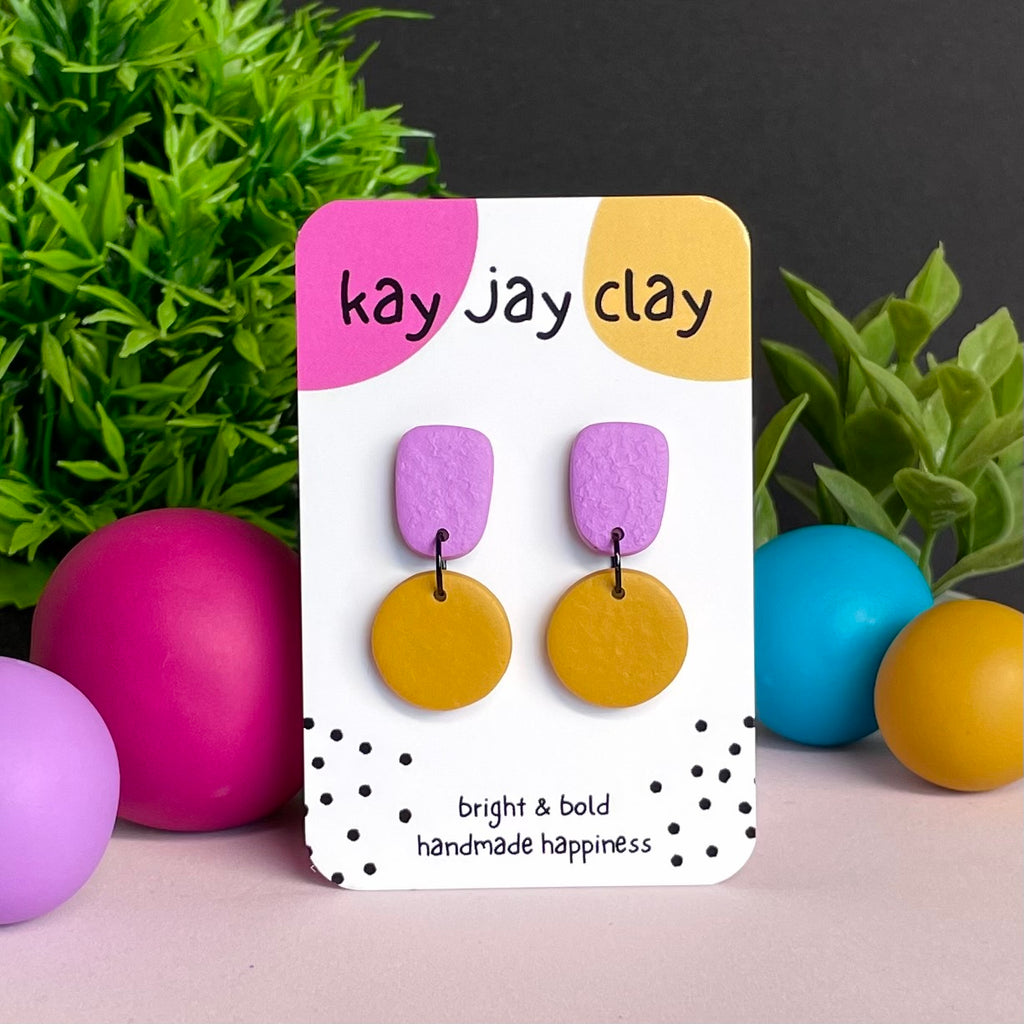 Lilac & Mustard Yellow colour pop dangle earrings on Kay Jay Clay branded mounting card