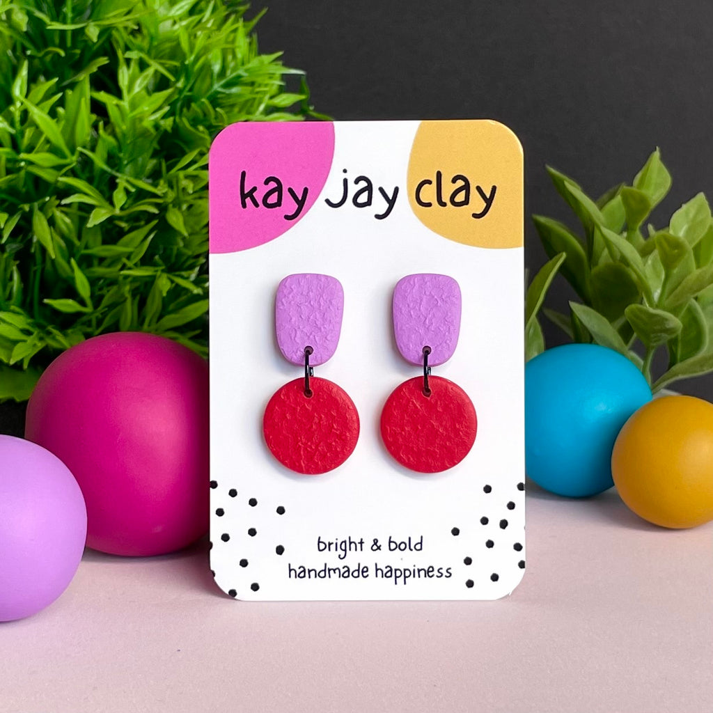 Lilac & Red colour pop dangle earrings on Kay Jay Clay branded mounting card