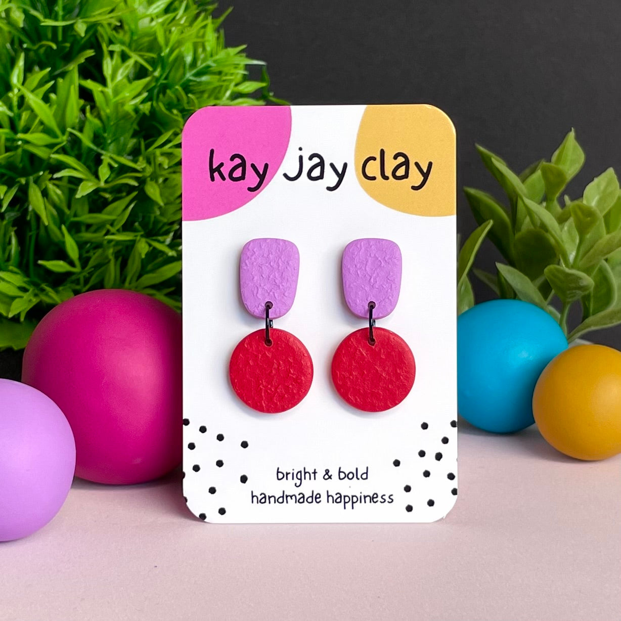 Lilac & Red colour pop dangle earrings on Kay Jay Clay branded mounting card