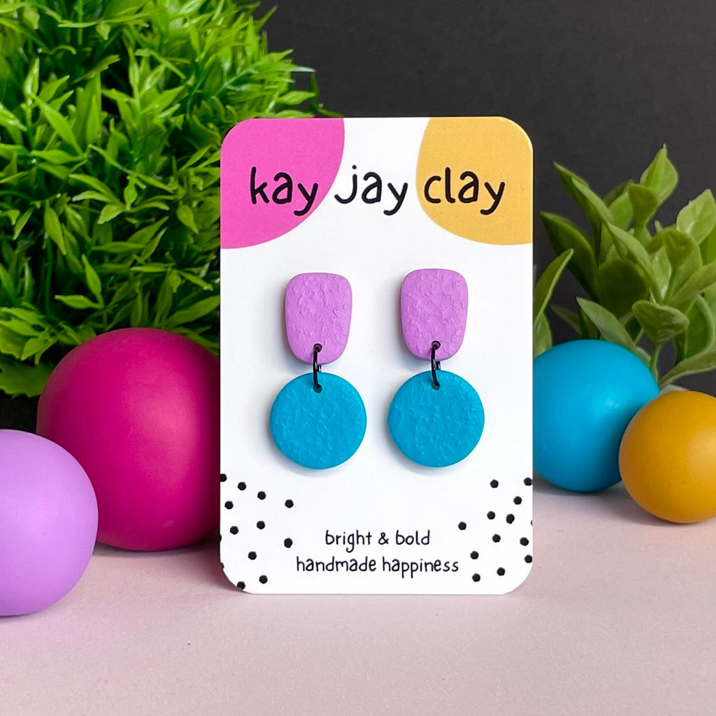 Lilac & Turquoise colour pop dangle earrings on Kay Jay Clay branded mounting card
