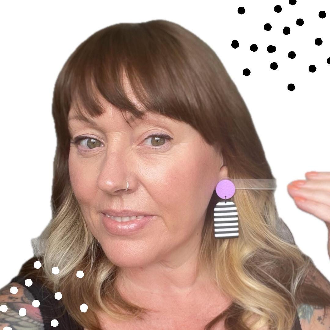Try on picture of Kerry from Kay Jay Clay wearing the Lilac monochrome stripe dangle earrings for size reference