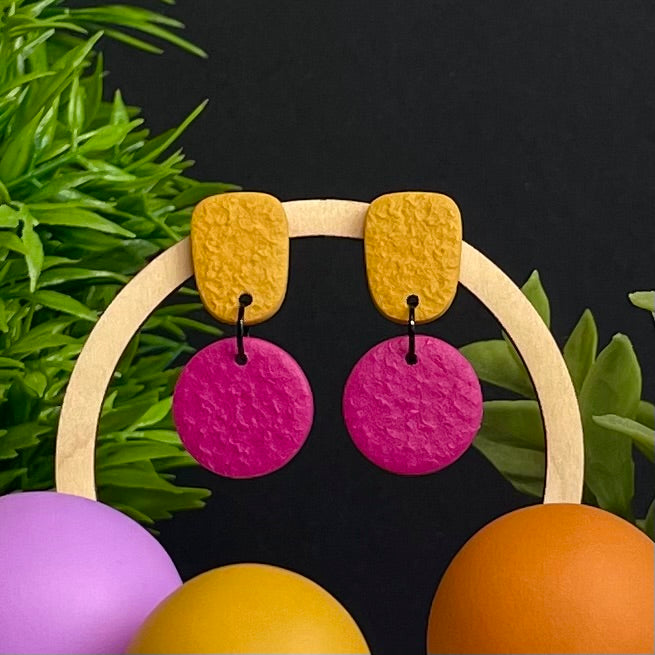 Mustard Yellow & Hot Pink colour pop dangle earrings on hoop display prop