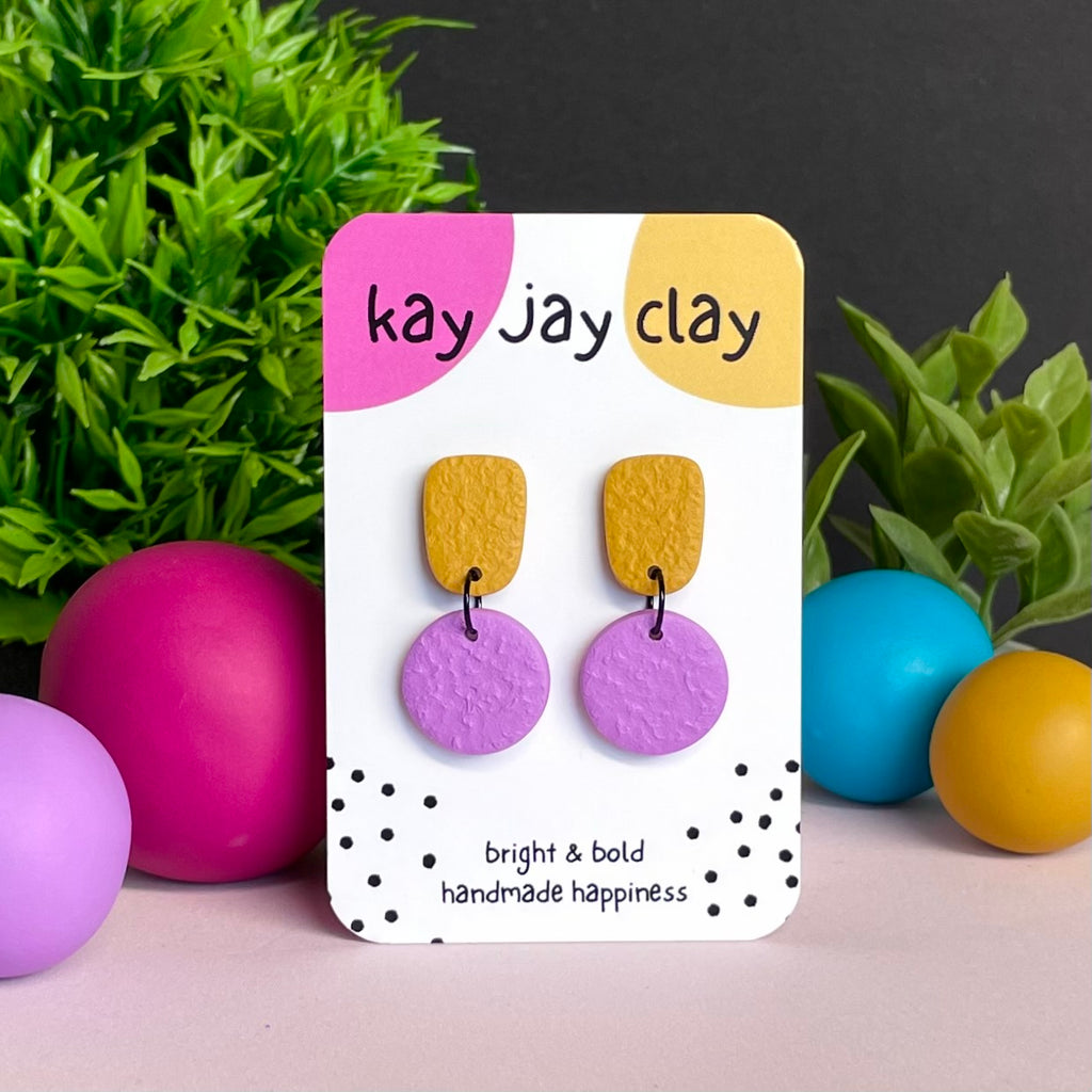 Mustard Yellow & Lilac colour pop dangle earrings on Kay Jay Clay branded mounting card