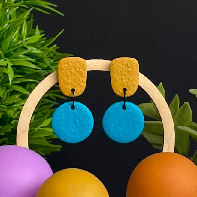 Mustard Yellow & Turquoise colour pop dangle earrings on hoop display prop