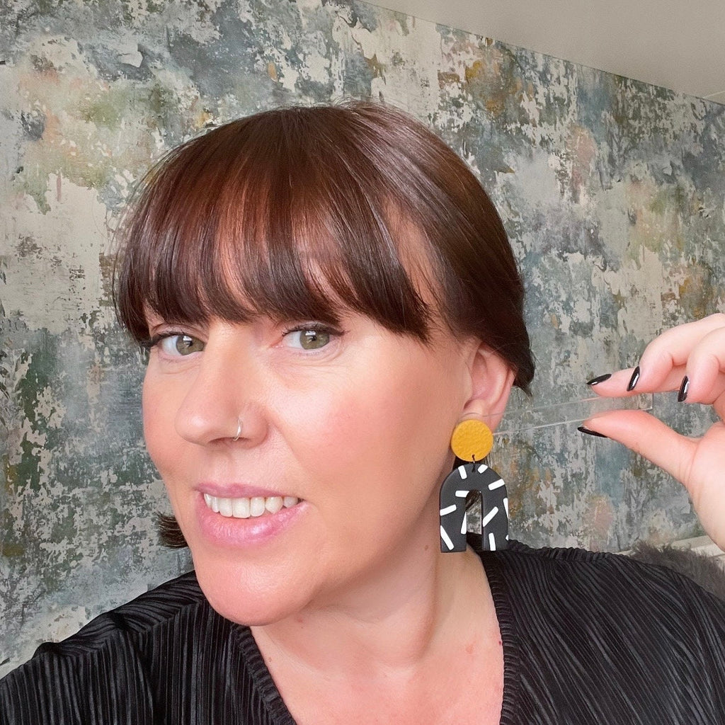try on picture of Kerry from Kay Jay Clay wearing the Mustard Yellow and monochrome sprinkles arch dangle earrings
