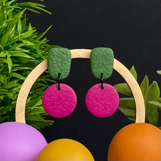 Olive Green & Hot Pink colour pop dangle earrings on hoop display prop