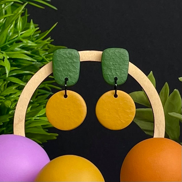 Olive Green & Mustard Yellow colour pop dangle earrings on hoop display prop