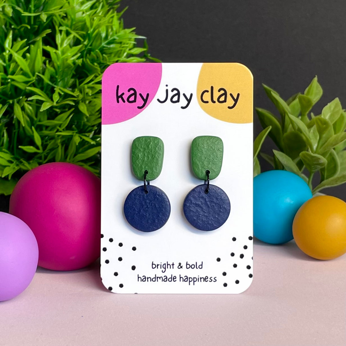 Olive Green & Navy Blue colour pop dangle earrings on Kay Jay Clay branded mounting card