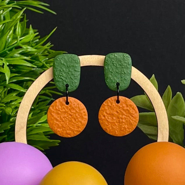 Olive Green & Orange colour pop dangle earrings on hoop display prop