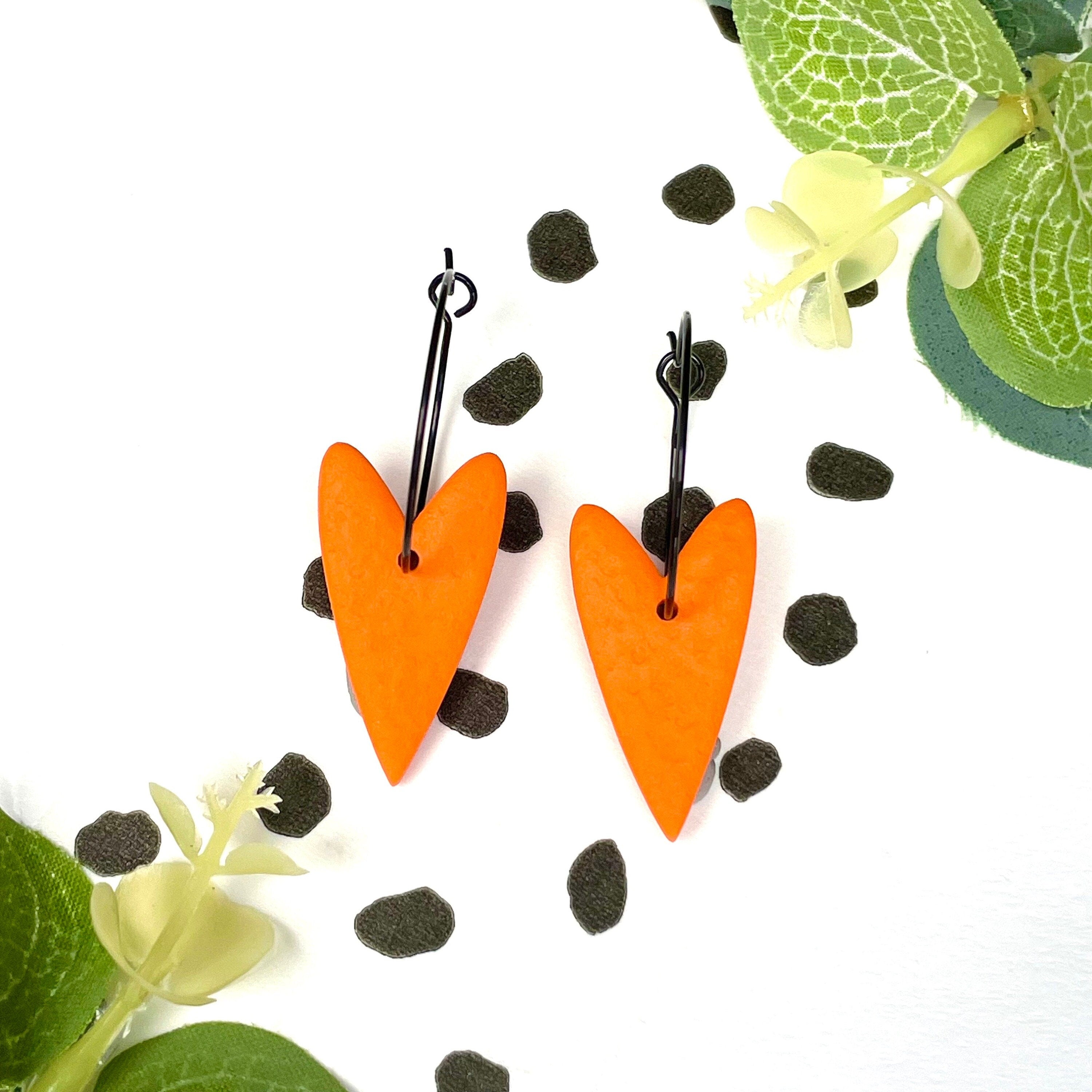 Orange heart earrings on black colour hoops