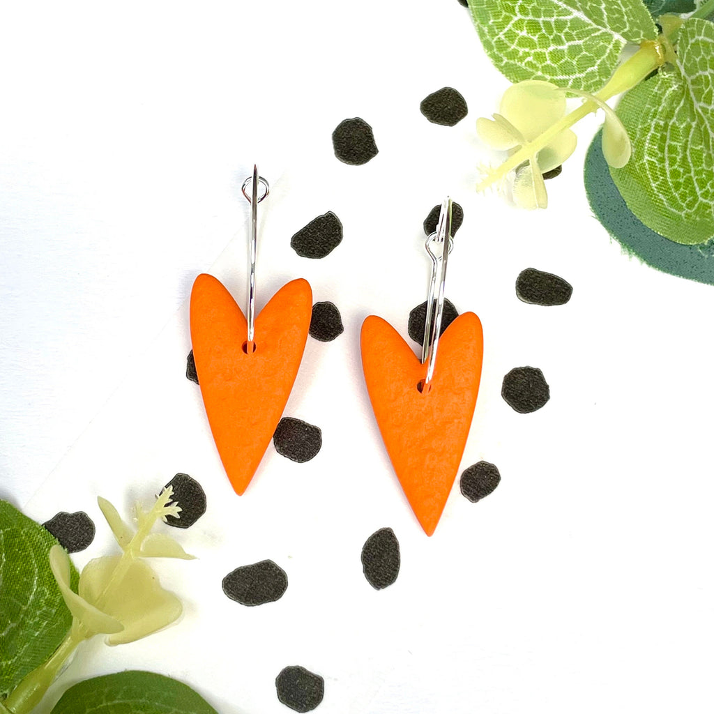 Orange hearts on silver colour hoops