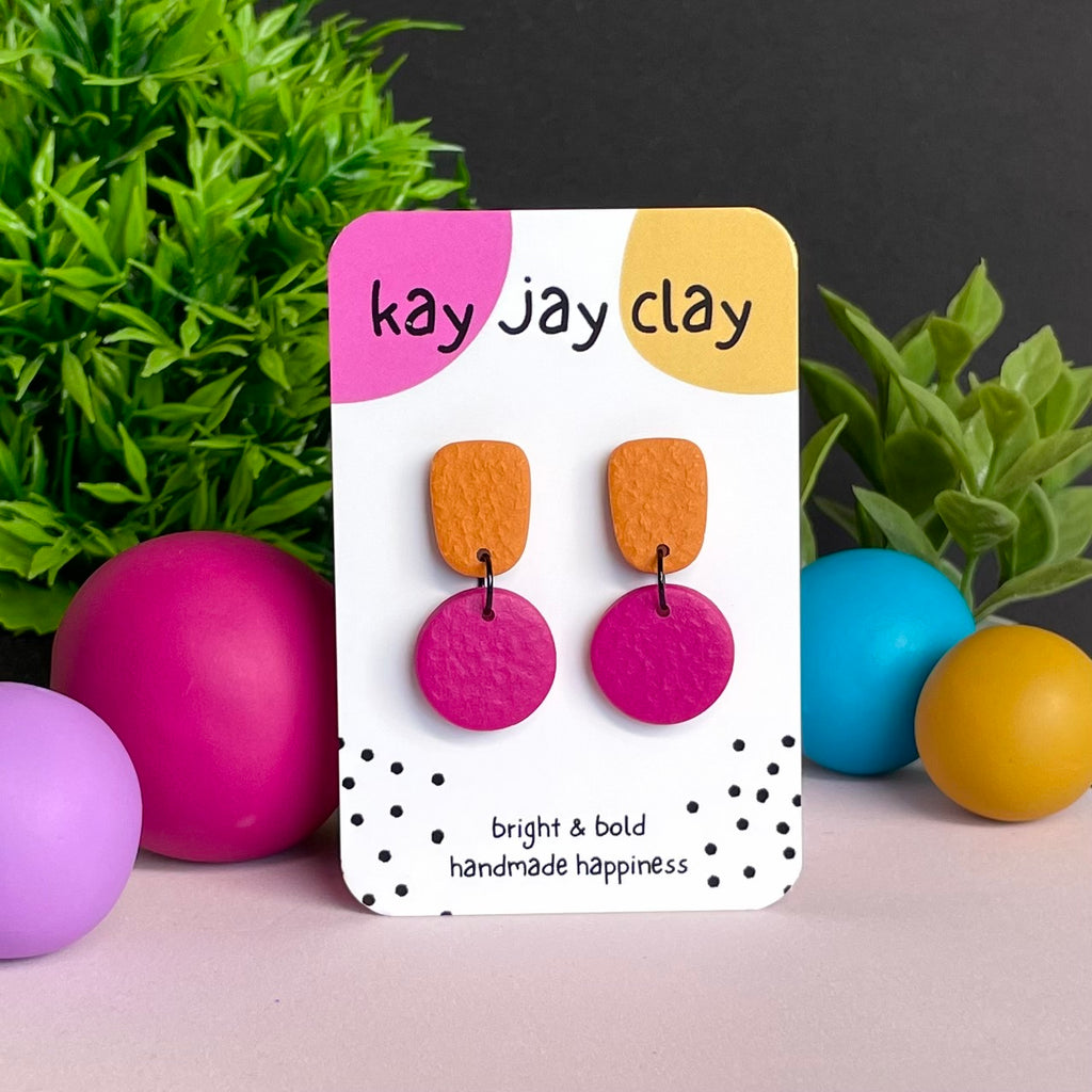 Orange & Hot Pink colour pop dangle earrings on Kay Jay Clay branded mounting card
