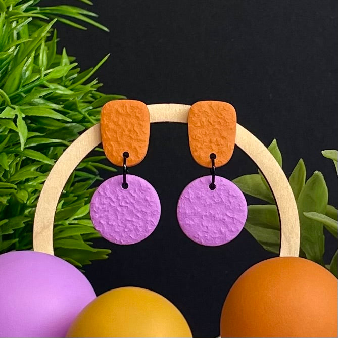 Orange & Lilac colour pop dangle earrings on hoop display prop