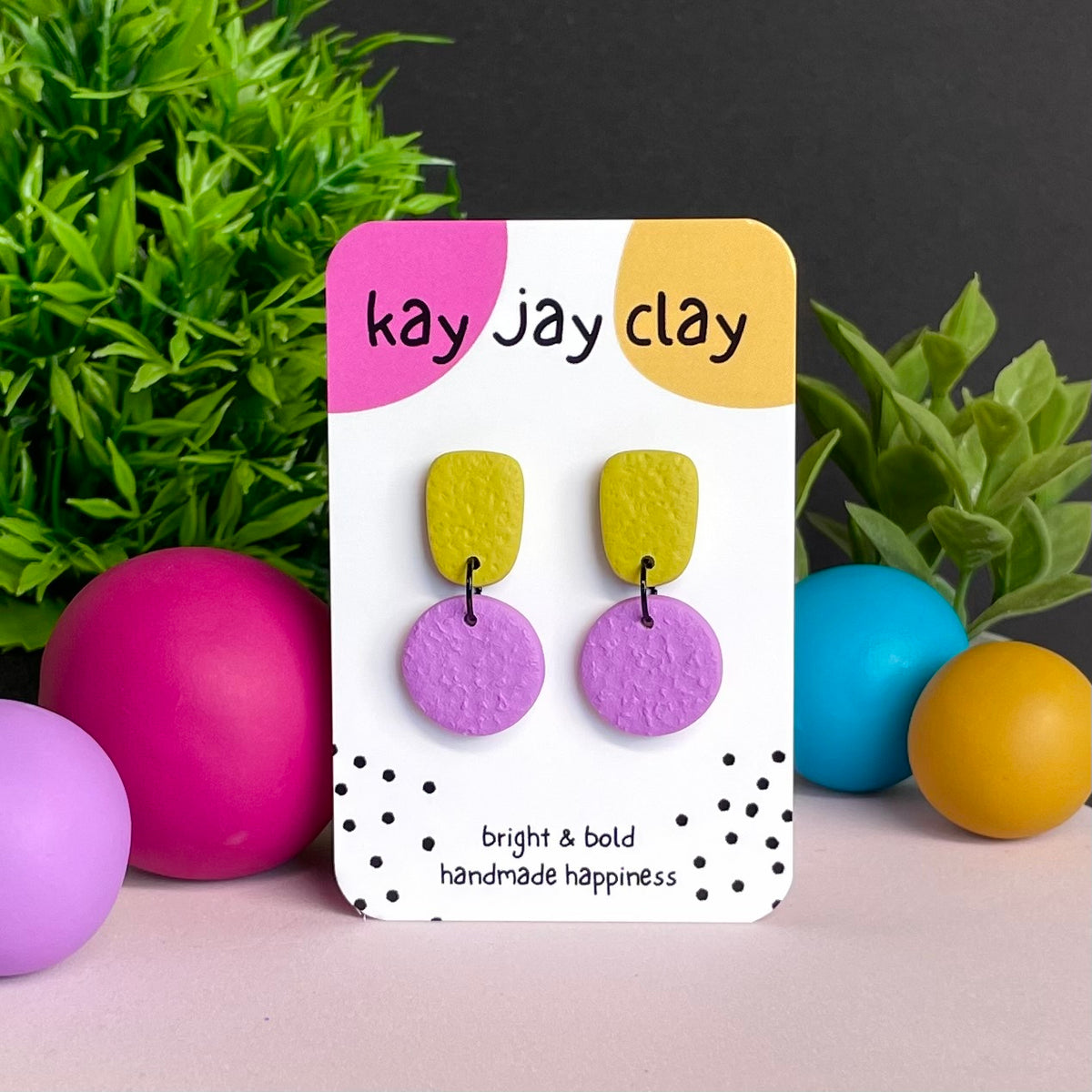 Pistachio Green & Lilac colour pop dangle earrings on Kay Jay Clay branded mounting card