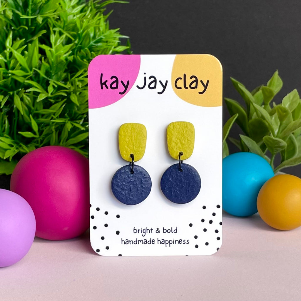 Pistachio Green & Navy Blue colour pop dangle earrings on Kay Jay Clay branded mounting card