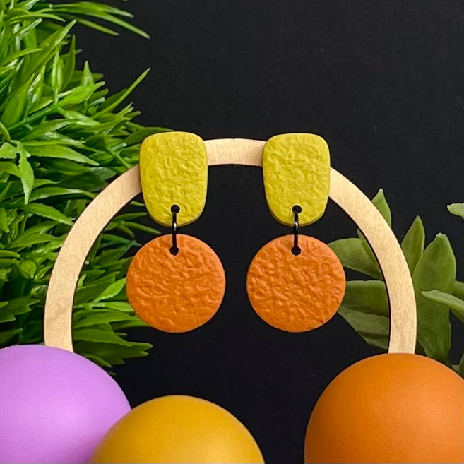 Pistachio Green & Orange colour pop dangle earrings on hoop display prop