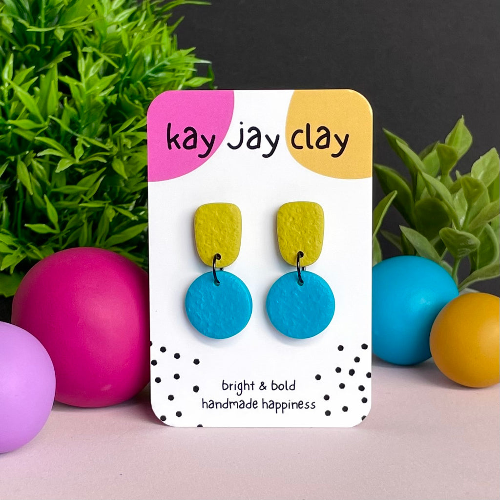 Pistachio Green & Turquoise colour pop dangle earrings on Kay Jay Clay branded mounting card