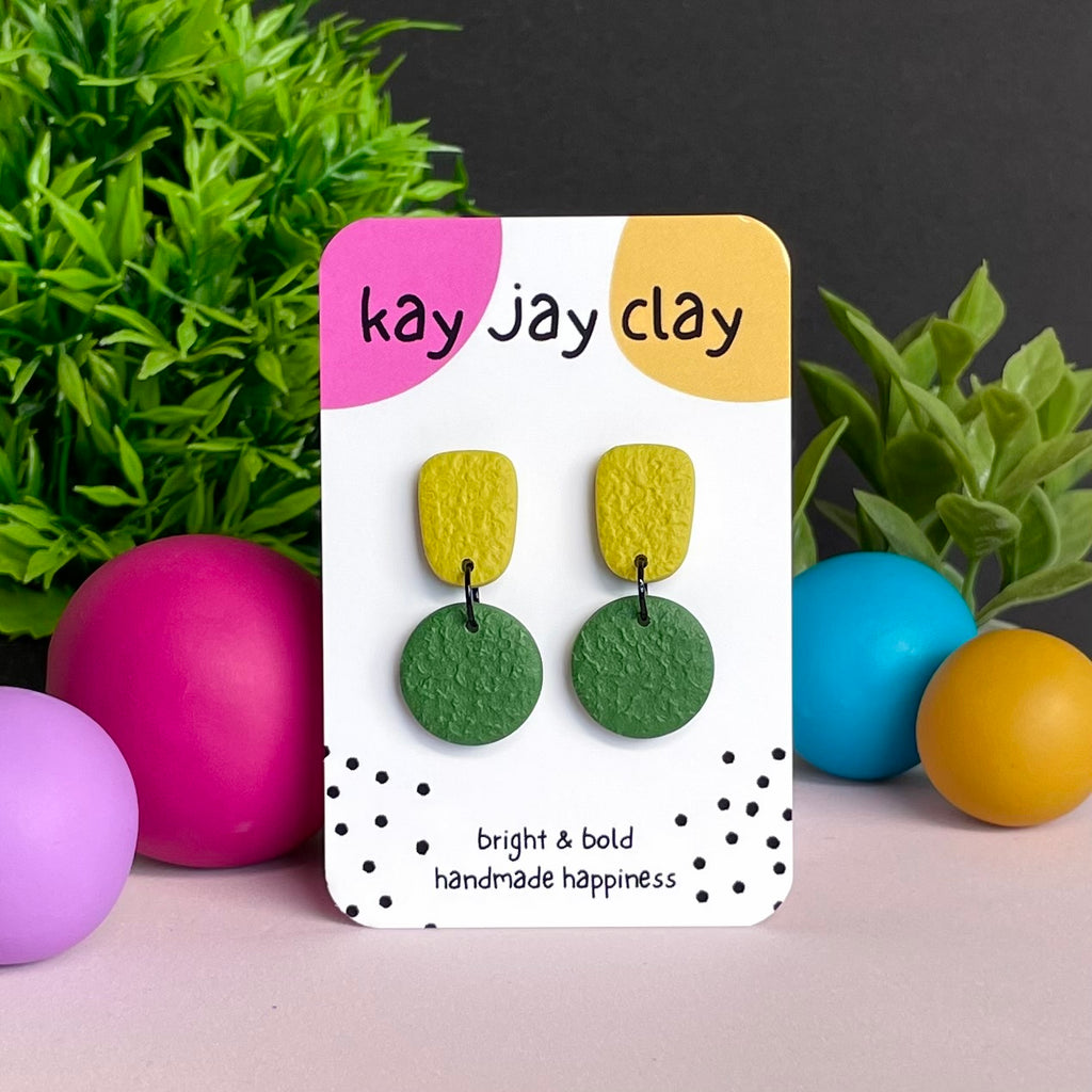 Pistachio & Olive Green colour pop dangle earrings on Kay Jay Clay branded mounting card