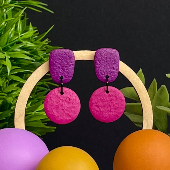 Purple & Hot Pink colour pop dangle earrings on hoop display prop