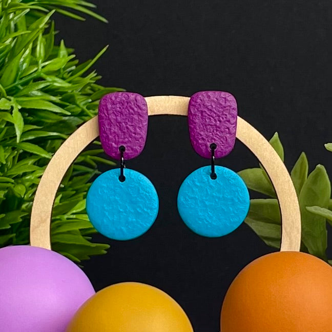 Purple & Turquoise colour pop dangle earrings on hoop display prop