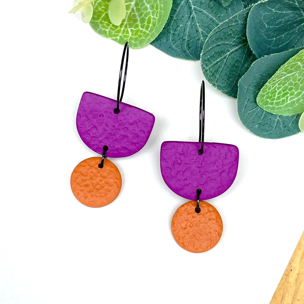 Purple and orange hoop earrings with black hoops