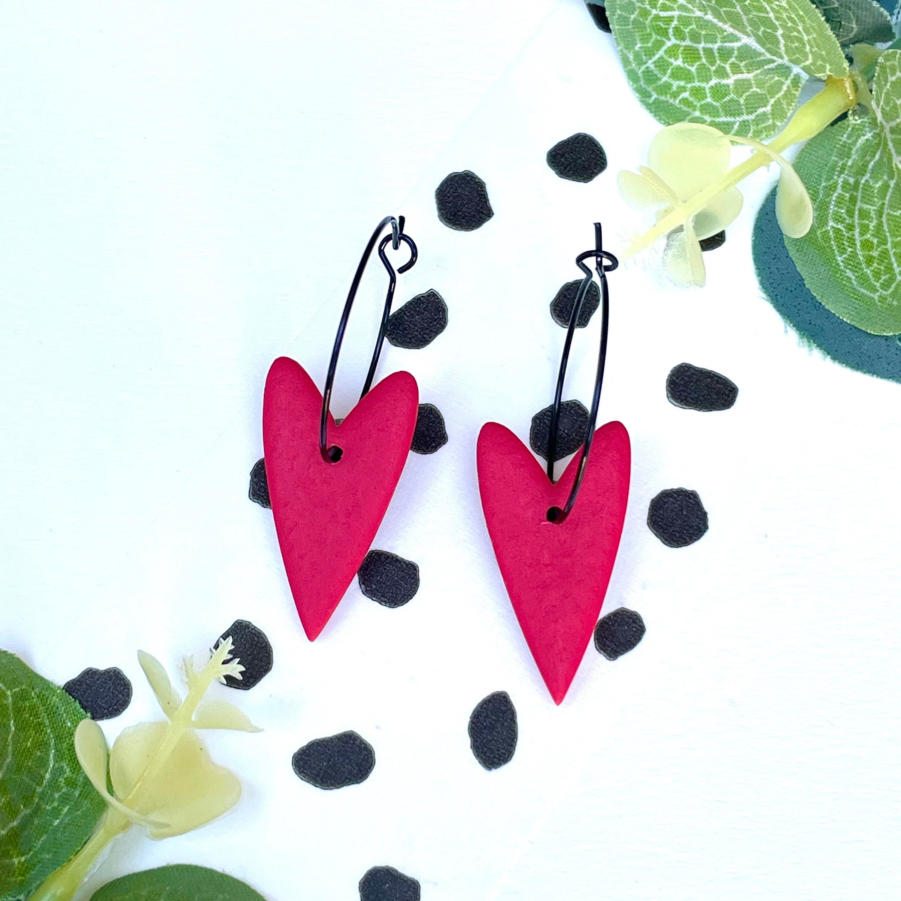 Bright red heart hoop earrings on a black colour hoop
